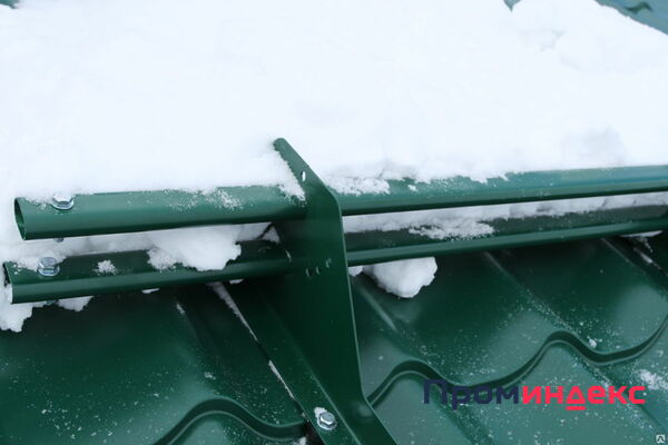 Фото Монтаж снегозадержателя на крыше